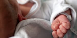 A girl is born to a mother in a coma